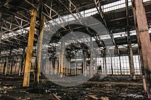 Abandoned metallurgical excavator plant or factory interior, industrial warehouse building waiting for a demolition