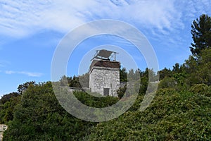 Abandoned military watchtower falling apart.