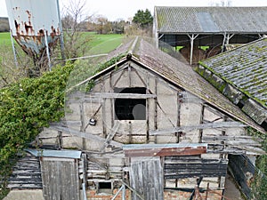 Abandoned milking parlour seen on an old dairy farm.