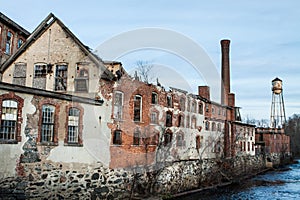 Abandoned Mill Building with Broken Windows