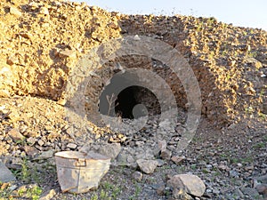 Abandoned Mine Site with Rusty Bucket in Arizona Desert