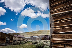 Abandoned mining equipment and buildings in the ghost town of Bodie, a California State Historical Park