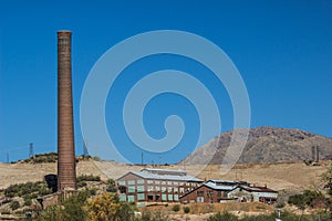 Abandoned Mining Operations With Buildings & Smokestack