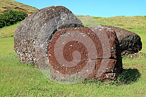 Abandoned Moai Statue`s Topknot with the Ancient Petroglyph on Red Scoria Stone at Puna Pau Volcano, Easter Island, Chile