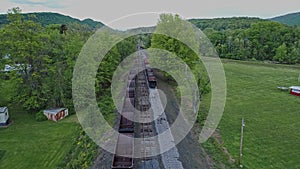 Abandoned Narrow Gauge Coal Rail Road with Rusting Hoppers and Freight Cars and Support Building Starting to be Restored