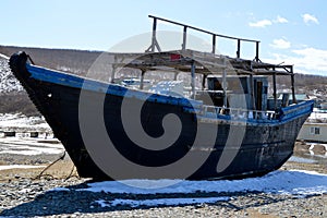 Abandoned North Korean fishing schooner on the shore of the Sea of â€‹â€‹Japan, Primorye, Russia.