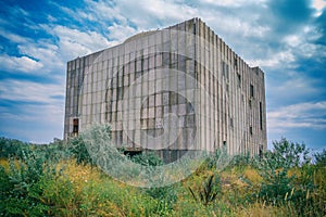 Abandoned nuclear power plant on a background of blue sky. Easy toning of the image