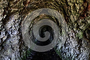 Abandoned Ocean Shore Railroad Creek Tunnel in Davenport, California, USA.