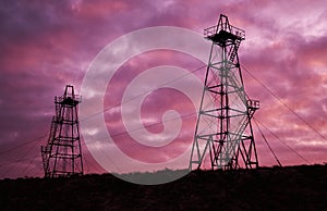 Abandoned oil rig with dramatic sky clouds