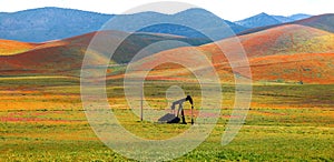 Abandoned oil well pump in the middle of scenic landscape at Carrizo plain national monument in California