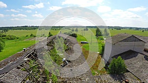 Abandoned old barn house. Broken roof. Low altitude flight. Aerial footage.