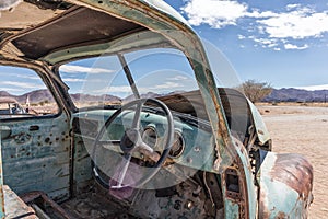 Abandoned old car interior in Namibia desert. place known as solitaire.