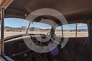 Abandoned old car interior in Namibia desert. place known as solitaire.