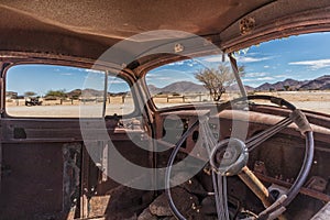 Abandoned old car interior in Namibia desert. place known as solitaire.