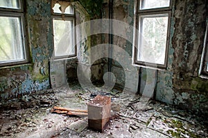 Abandoned, old. creepy, ruined room with windows covered in the building located in the Chernobyl ghost town