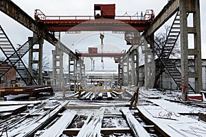 Abandoned old factory with bridge crane