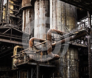Abandoned old historic metallurgy factory industrial pipes