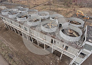 Abandoned old russian soviet style Metal - gas chemical processing factory plant with cooling wind turbines