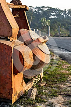 Abandoned Old Rusty Cement Mixer Machine beside the road