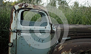 Abandoned old rusty pick-up truck.