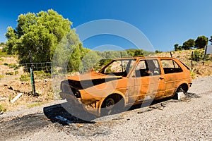 Abandoned old rusty wreck of a car