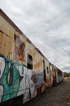Abandoned old train with rust and graffitis