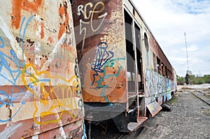 Abandoned old train with rust and graffitis