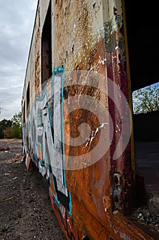 Abandoned old train with rust and graffitis