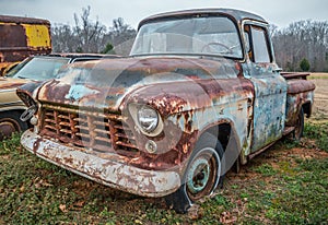 Abandoned old truck in a field