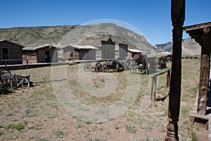 Abandoned Old West Log Buildings and Wooden Wagons