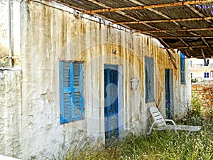 Abandoned old white greek house