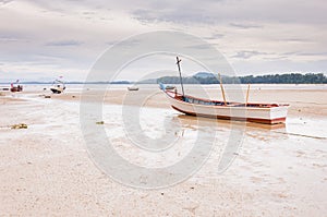 Abandoned old wooden boat on the beach in Phuket, Thaialnd