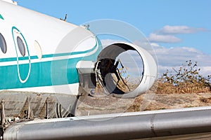 Abandoned passenger airplane. Broken vandalised and stolen engine