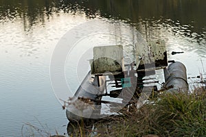 Abandoned pedalo cycle boat in lake