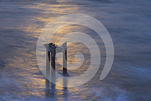 Abandoned Pier pillar near Davenport, at sunset photo