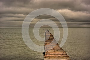 Abandoned Pier Stretching Out Into The Gulf of Mexico