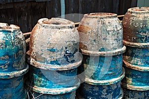 Abandoned pottery bowls stacked outside