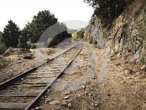 Abandoned railroad tracks through the mountains