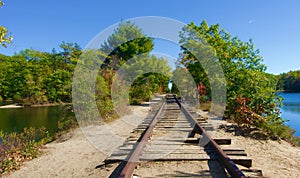 Abandoned railroad tracks running over a wilderness lake in Maine