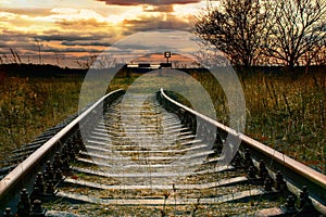 Abandoned railway at sunset. Signs of railway deadlock