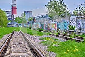 abandoned railway tracks in an industrial zone color