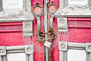 Abandoned Red Church Doors with Chain and Lock