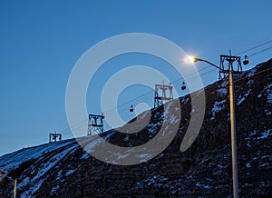 Abandoned remains of a coal cableway in the light of the polar night noon