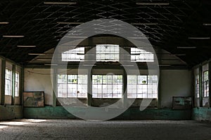 Abandoned riding hall without horses and horsemen