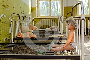 Abandoned room after the disaster. Children`s toys in the dirt in an abandoned kindergarten in Chernobyl