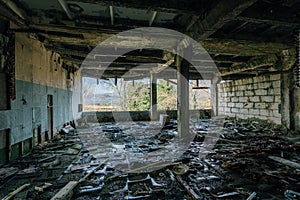 Abandoned rotten and overgrown industrial building in Sukhum, Abkhazia. Consequences of war