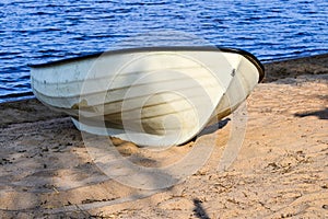 Abandoned rowboat on the beautiful beach