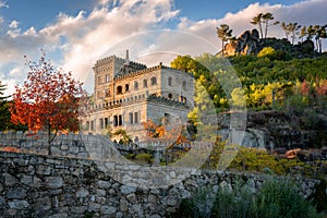 Abandoned ruin building of Termas Radium Hotel Serra da Pena in Sortelha with beautoful colorful trees at sunset, Portugal