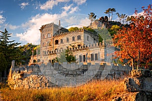 Abandoned ruin building of Termas Radium Hotel Serra da Pena in Sortelha with beautoful colorful trees at sunset, Portugal photo