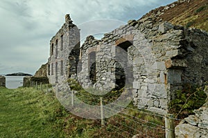 The abandoned ruined factory buildings of the Llanlleiana old porcelain works at Llanbadrig